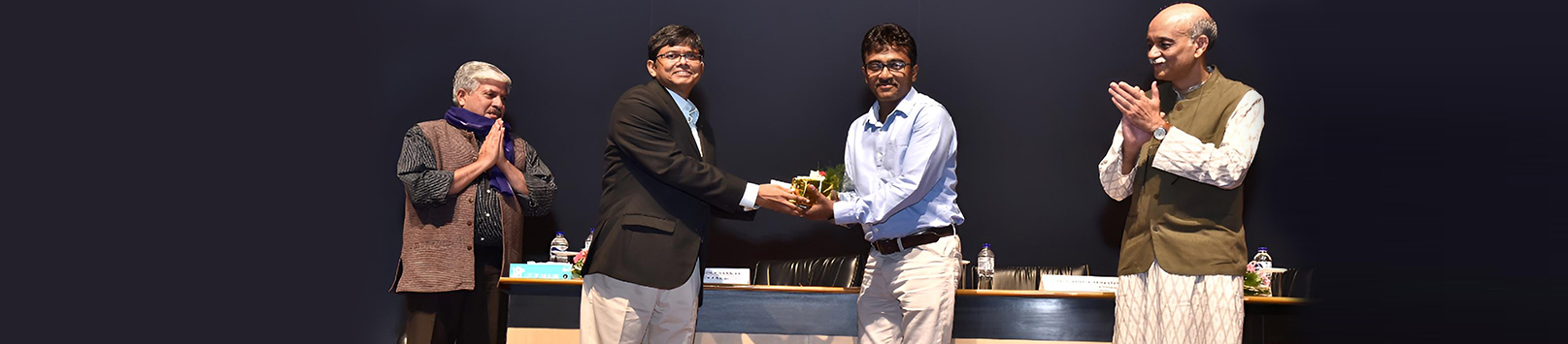 Mr Moloy Pakre being felicitated on his 25th year of service with the Institute by Prof Sahadeb Sarkar, Director-in-Charge, IIM Calcutta